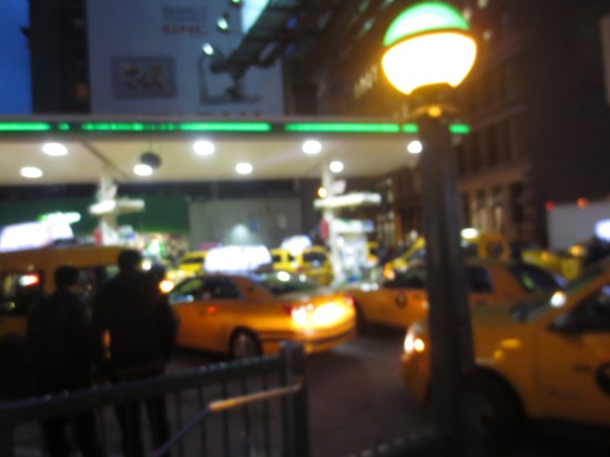 busy gas station full of taxis