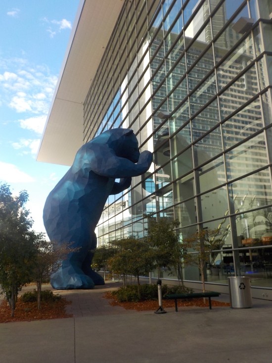 blue bear peeking into the convention center